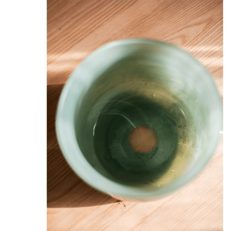 Ruhai Low Glass Vase by RusticReach, green glaze, short cylindrical vase on wood floor on Tampa Home & Garden Store