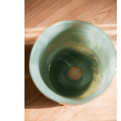 Ruhai Low Glass Vase by RusticReach, green glaze, short cylindrical vase on wood floor on Tampa Home & Garden Store