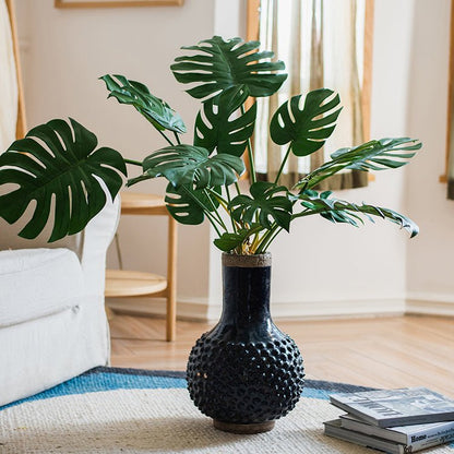 Large Navy Blue Domo coarse pottery vase with textured surface and monstera leaves on Tampa Home & Garden Store