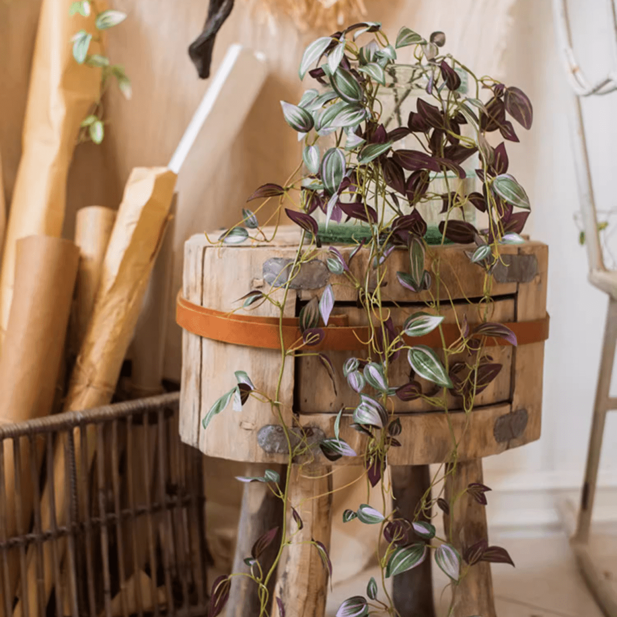 Artificial Small Leaf Vine 40 inch long with purple-green variegated leaves over a crate on Tampa Home & Garden Store