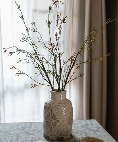 RusticReach artificial Japanese Zen sedge stems in a beige ceramic vase on Tampa Home & Garden Store