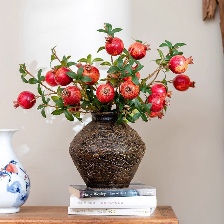 Faux Short Pomegranate Stem 15 inches tall RusticReach in a dark textured vase with green leaves on Tampa Home & Garden Store