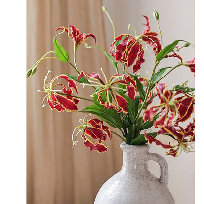 Faux Silk Flame Lily Stem 29 tall red blooms with yellow-edged petals in a speckled vase on Tampa Home & Garden Store