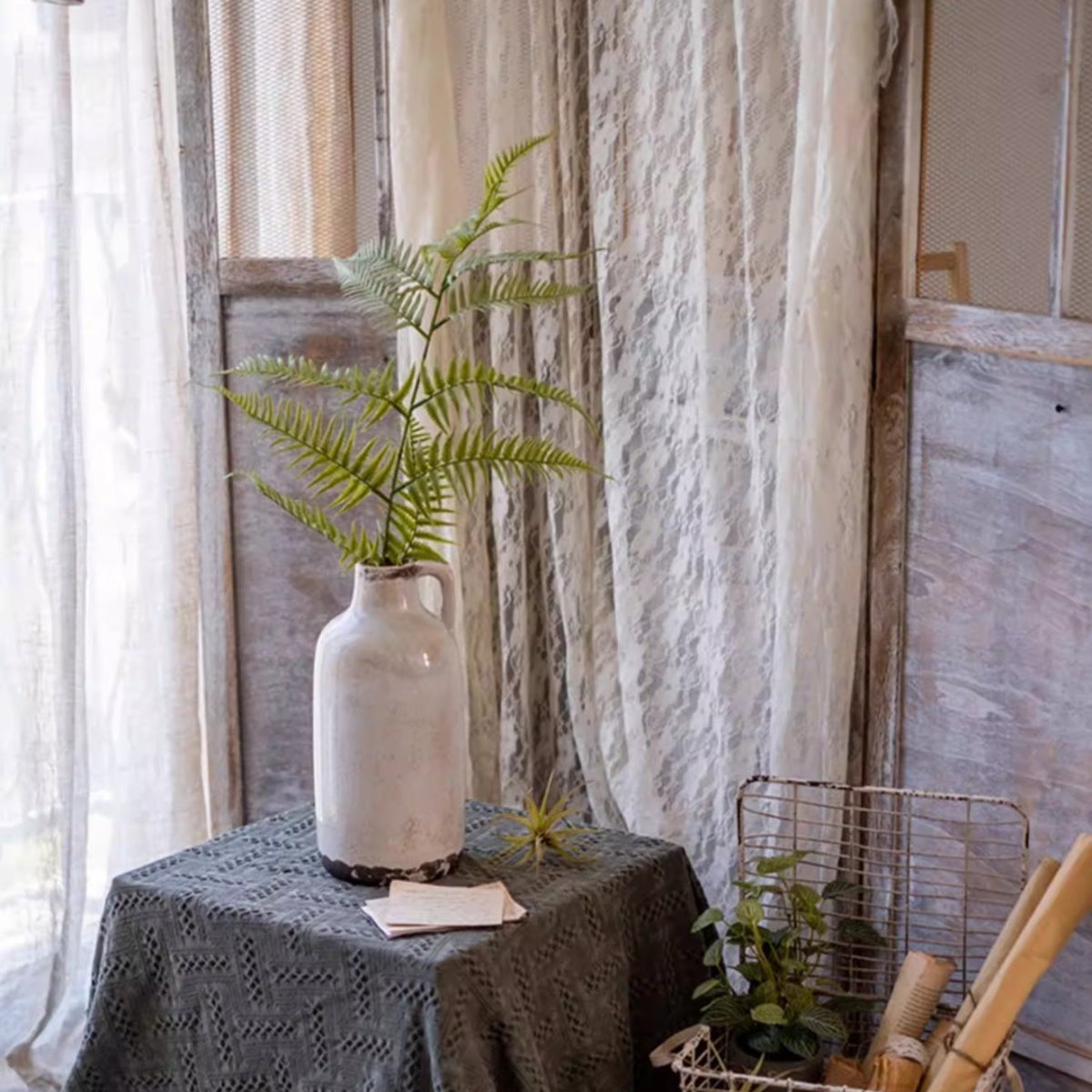 Artificial Tall Fern Leaf Stem by RusticReach in a white ceramic vase on a rustic table on Tampa Home & Garden Store