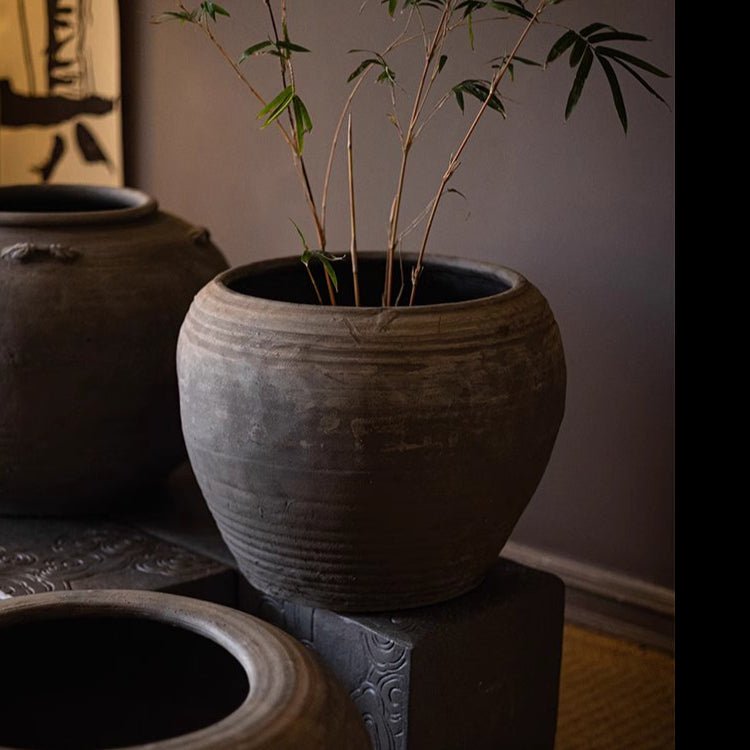 Traditional Round Belly Zen Style Ceramic Vase by RusticReach, dark gray with subtle rings on Tampa Home & Garden Store