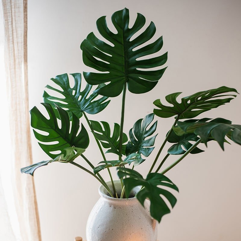 Artificial Turtle Leaf Stem Bunch by RusticReach in a vase with green monstera leaves on Tampa Home & Garden Store