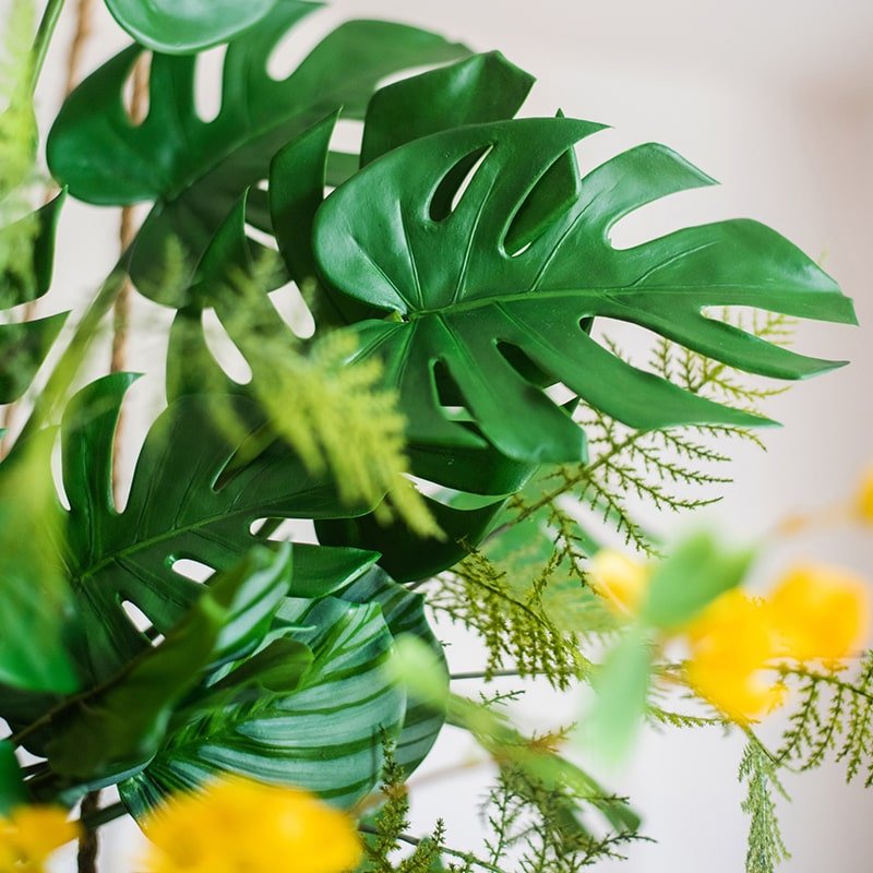 Artificial Turtle Leaf Stem Bunch with large green Monstera leaves and fern-like greenery on Tampa Home & Garden Store
