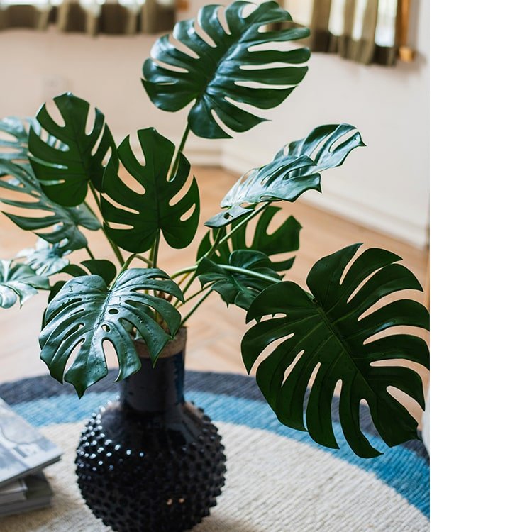 Artificial Turtle Leaf Stem Bunch RusticReach in a textured black vase with dark green leaves on Tampa Home & Garden Store