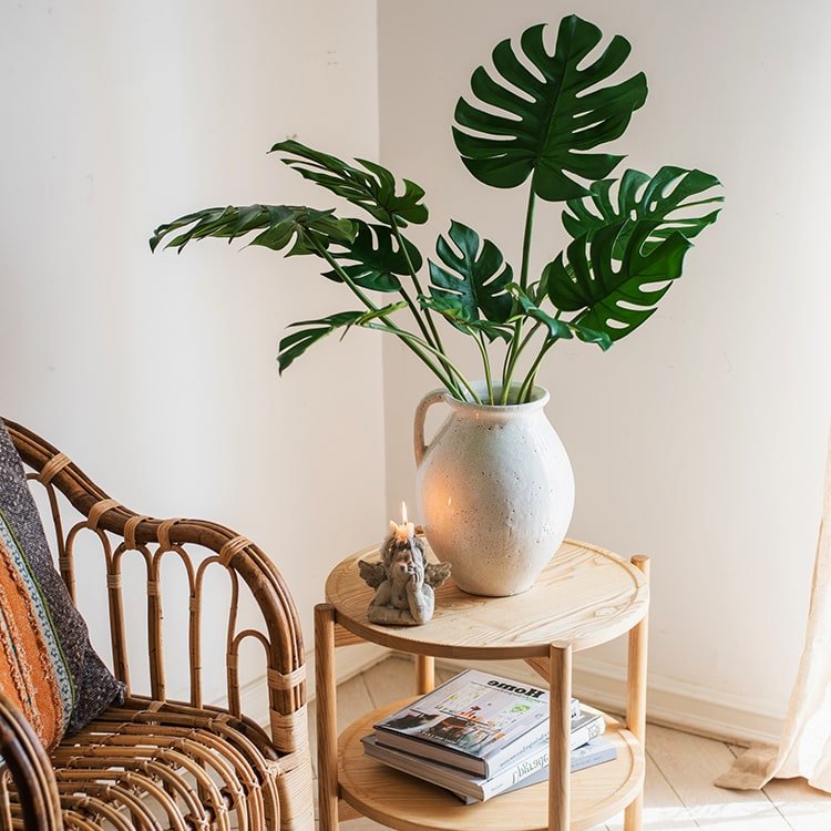 Turtle Leaf Stem Bunch with Monstera leaves in speckled pitcher on wood end table RusticReach on Tampa Home & Garden Store