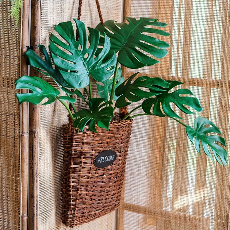 Artificial Turtle Leaf Stem Bunch by RusticReach with green leaves in a woven basket on Tampa Home & Garden Store