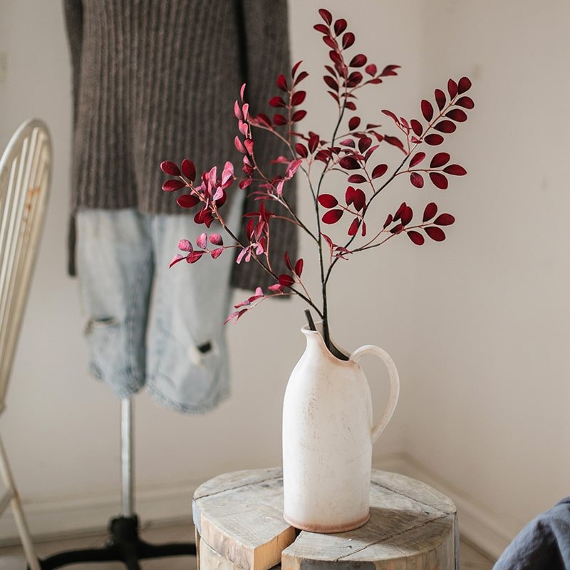 Red Tzu Tan Leaf Stem 42in RusticReach in white pitcher on a table on Tampa Home & Garden Store