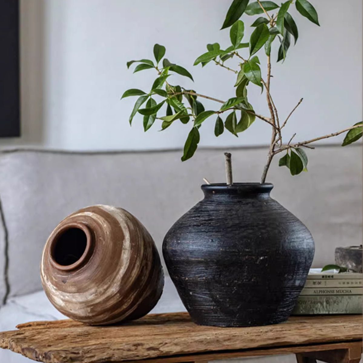 Vintage Wabi-Sabi ceramic jars: black textured vase with greenery and tan jar RusticReach on Tampa Home & Garden Store