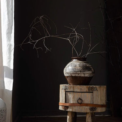 Vintage Wabi-Sabi ceramic jar by RusticReach with brown glaze on wood table; branches inside on Tampa Home & Garden Store