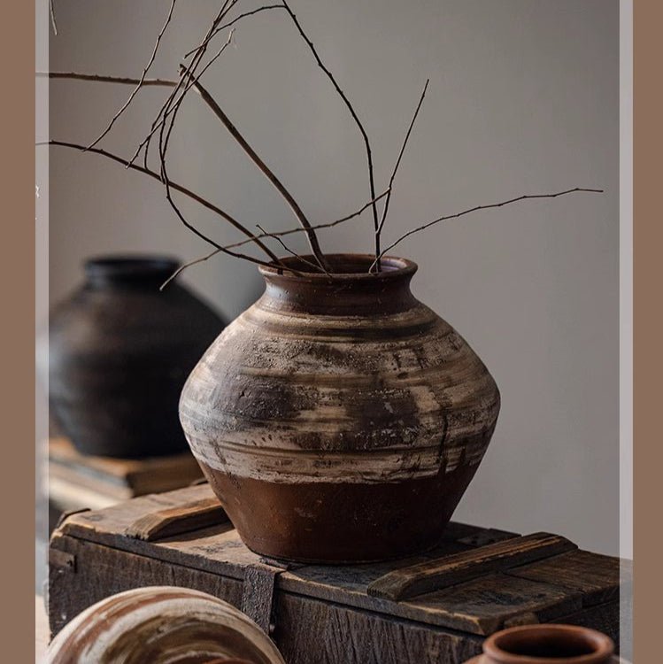 Vintage Wabi-Sabi ceramic jar with brown-gray glaze and dried branches on a wooden crate on Tampa Home & Garden Store