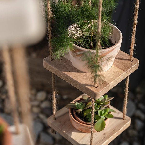 Wooden rope hanging plant shelf with white ceramic pot on top and terracotta pot RusticReach on Tampa Home & Garden Store