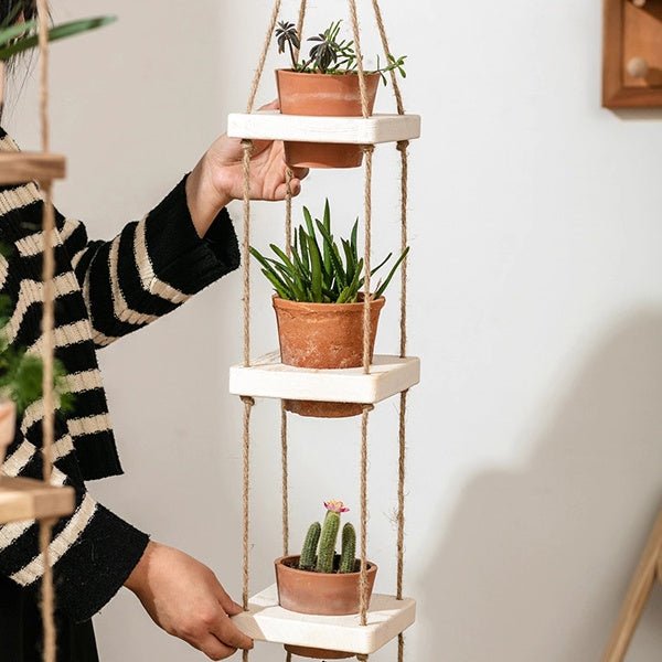 Wooden rope hanging plant shelf with three white tiers and terracotta pots RusticReach on Tampa Home & Garden Store