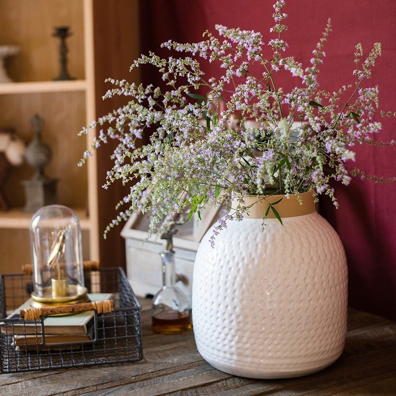 White glazed ceramic vase with textured surface, RusticReach, filled with purple-white flowers on Tampa Home & Garden Store