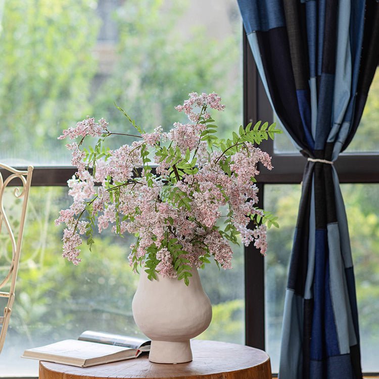 Enchanted Garden Wisteria Stem 51in artificial plant in a cream vase with pink blossoms on Tampa Home & Garden Store