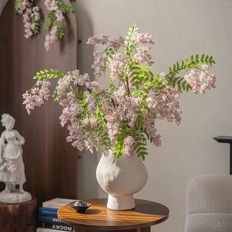 Enchanted Garden Wisteria Stem 51 in tall with pink blossoms and green leaves in a vase on Tampa Home & Garden Store