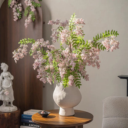 Enchanted Garden Wisteria Stem 51 in tall with pink blossoms and green leaves in a vase on Tampa Home & Garden Store