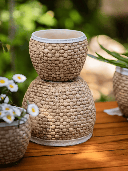 Woven Rattan Cement Planter RusticReach tan braided texture with a light cement rim on Tampa Home & Garden Store