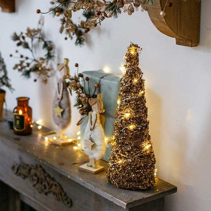 Christmas Rattan Cone Tree in Gold by RusticReach with warm lights on mantel on Tampa Home & Garden Store