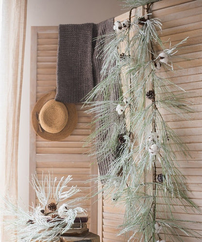 Frosted pine needle garland with faux snow and pinecones on Tampa Home & Garden Store
