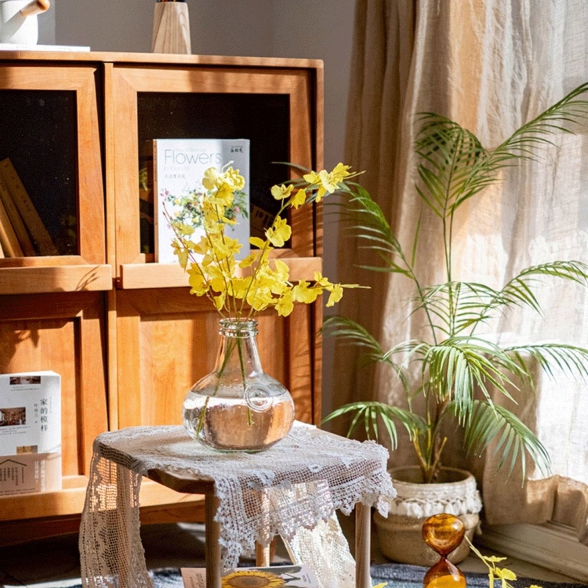 Faux Silk Yellow Dancing Lady Orchid stem bundle, 19in tall, in clear glass vase on lace table on Tampa Home & Garden Store