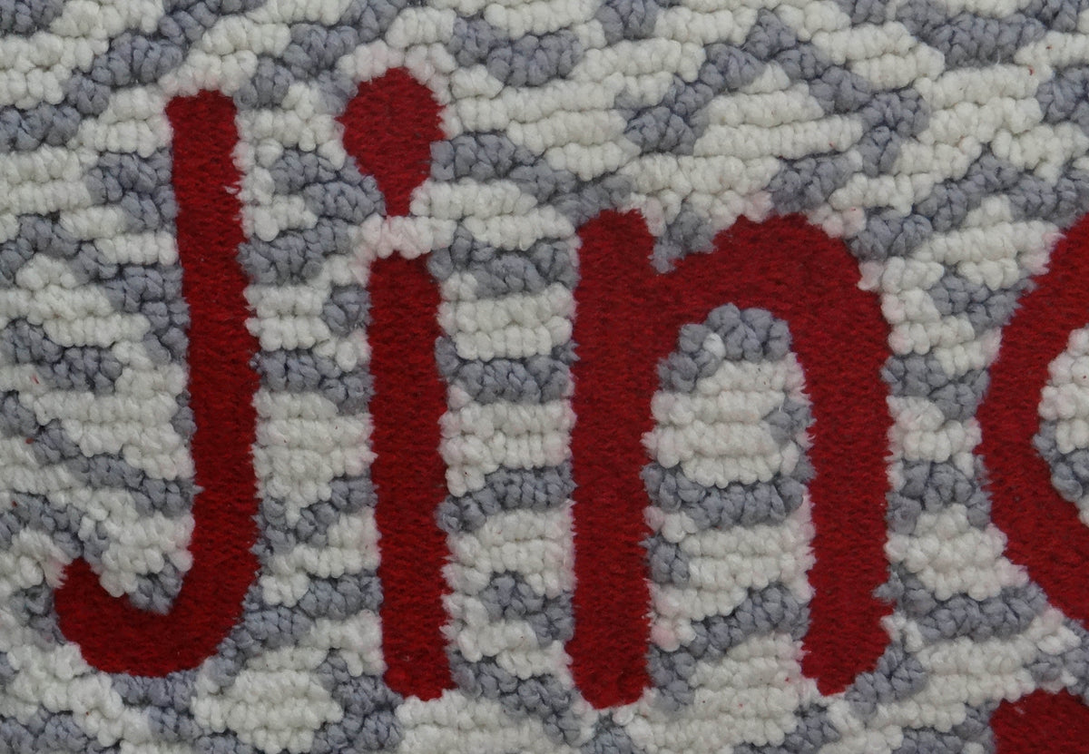 Vibhsa Jingle decorative pillow 14x20: red lettering on gray and white chunky woven fabric on Tampa Home & Garden Store