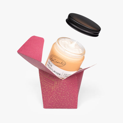 UpCircle Face Moisturizer Jumbo in peach cream, jar with black lid beside pink speckled box on Tampa Home & Garden Store
