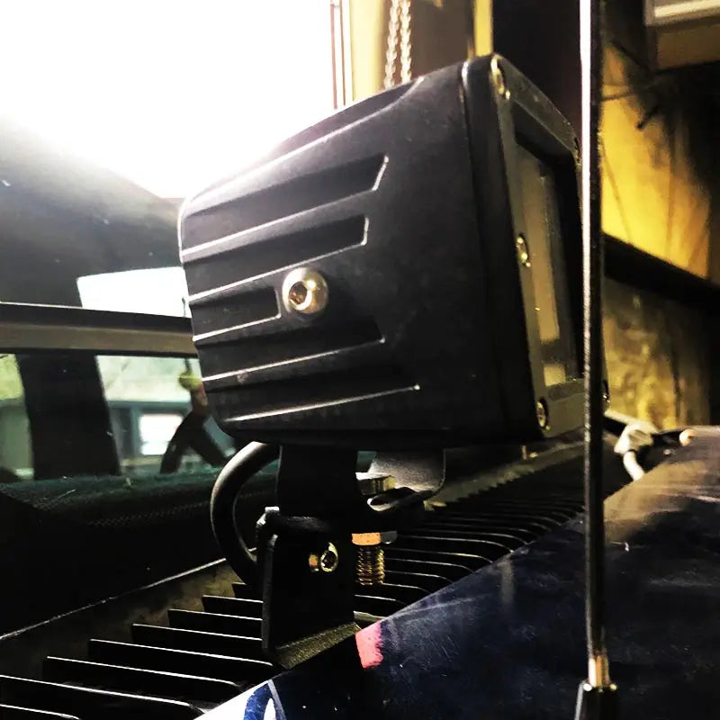Hood light mounts Apoc Industries, black aluminum ditch-light housing with bracket on C/K hood on Tampa Home & Garden Store