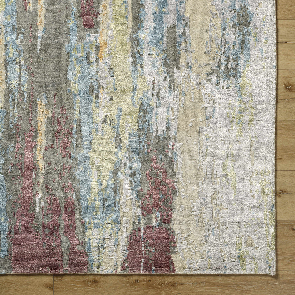 Kabugao Handmade Premium Wool Rug abstract multicolor pattern in beige blue gray tones on wood floor on Tampa Home & Garden Store