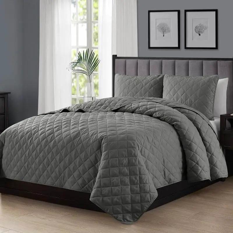 King/CAL King 3-Piece Dark Grey Polyester Microfiber Diamond Quilted Quilt Set on grey bed on Tampa Home & Garden Store