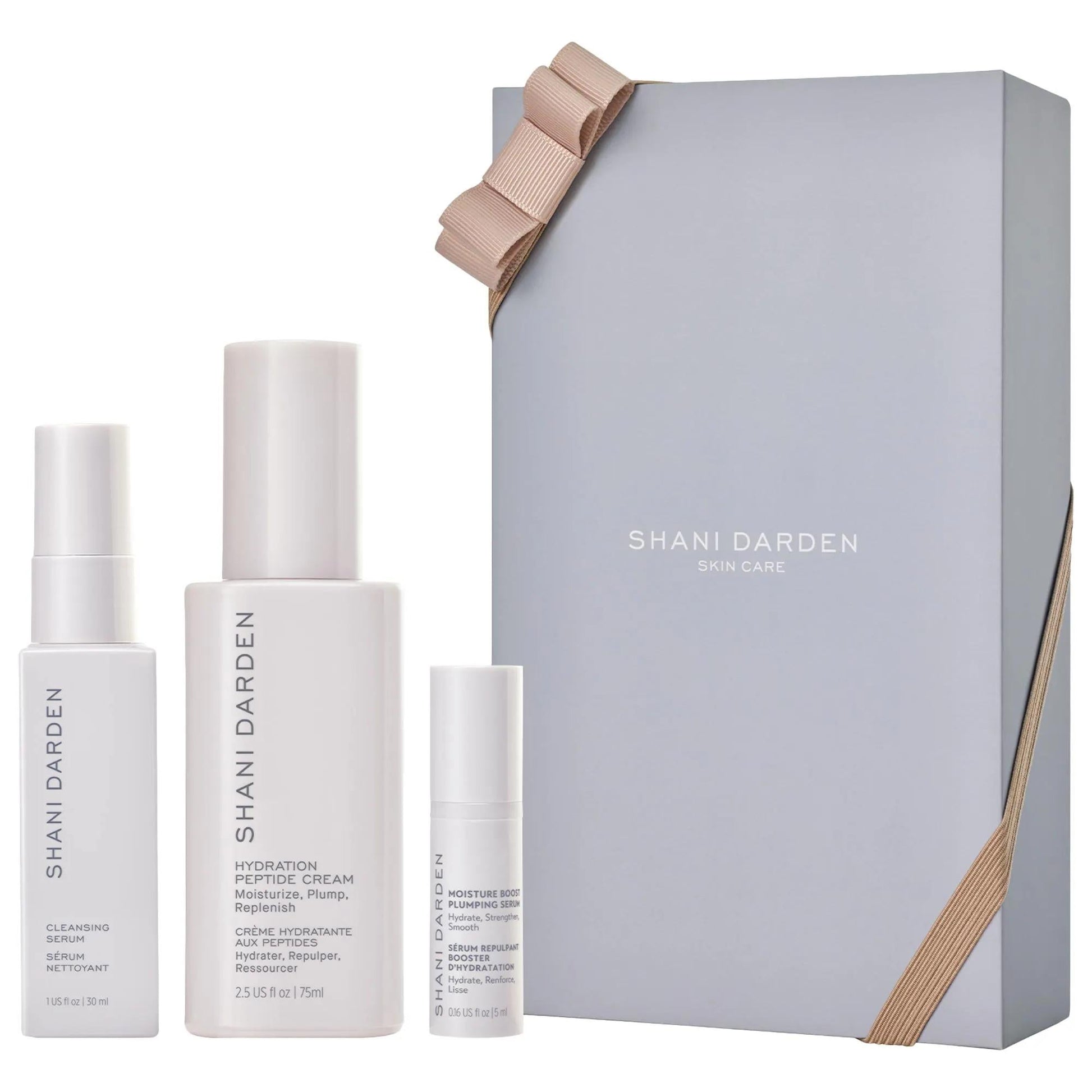Shani Darden Skin Care gift set with white pump bottles and beige ribbon on gray box on Tampa Home & Garden Store