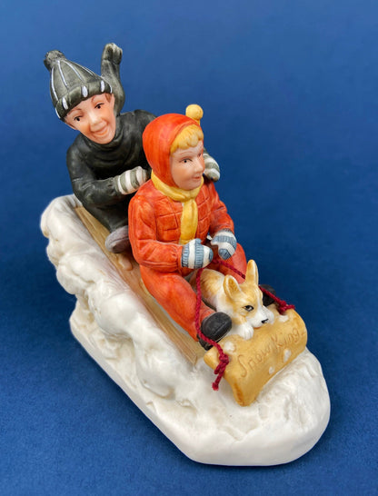 Kids & Dog on Sled Porcelain Figurine. Christmas. Downhill Racer. Inspired by Norman Rockwell. Museum Collections. Snow King. Collectibles. - Tampa Home & Garden Store