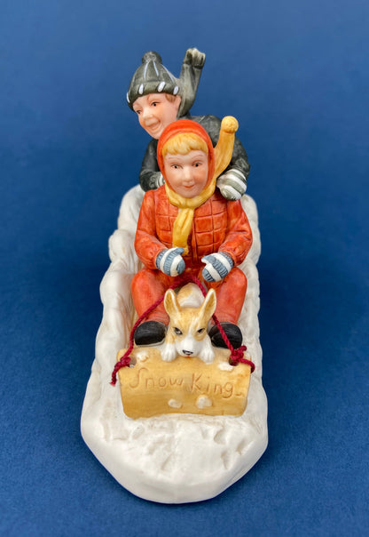 Kids & Dog on Sled Porcelain Figurine. Christmas. Downhill Racer. Inspired by Norman Rockwell. Museum Collections. Snow King. Collectibles. - Tampa Home & Garden Store