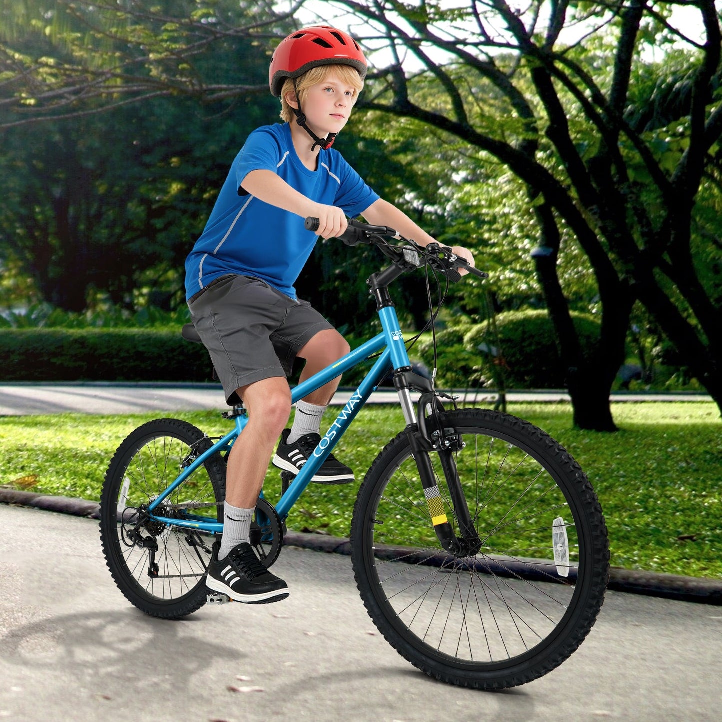 Kids blue GemGear mountain bike 20/24in with front suspension ridden by a boy in red helmet on Tampa Home & Garden Store