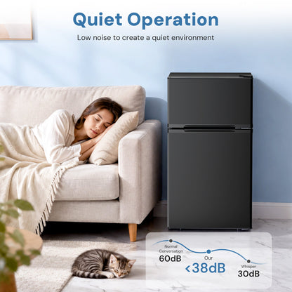 Kismile 3.2 Cu Ft mini refrigerator with freezer, black finish, placed beside beige sofa on Tampa Home & Garden Store