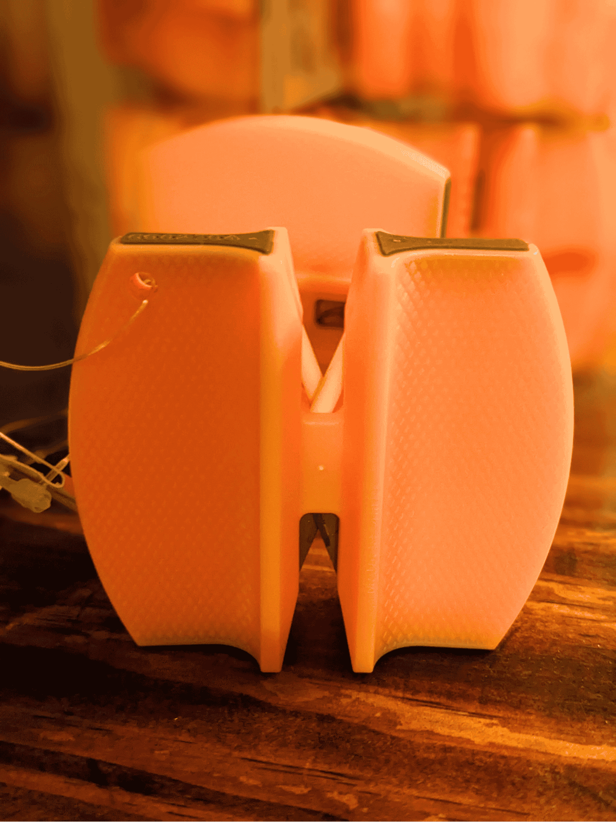 Carbide Ceramic Double-Sided Knife Sharpener pair with dual sharpening slots on orange plastic bases on Tampa Home & Garden Store