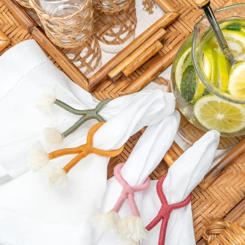 Colorful nautical knot napkin rings set of four with tassels on white napkins on Tampa Home & Garden Store