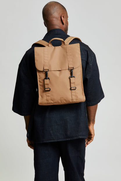 Handy XL Backpack Toffee by Lefrik USA, tan fabric with front flap and buckle straps worn denim on Tampa Home & Garden Store