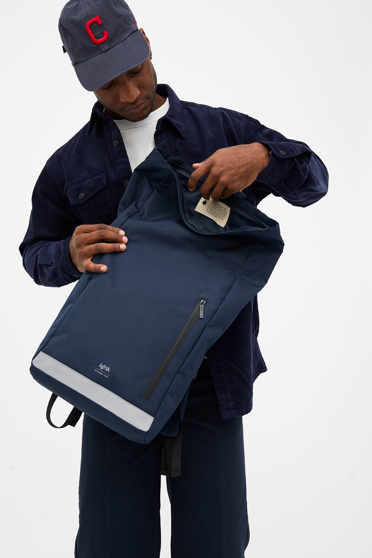 Roll Reflective Backpack Navy with Roll Closure by Lefrik USA, navy fabric with front zip pocket on Tampa Home & Garden Store