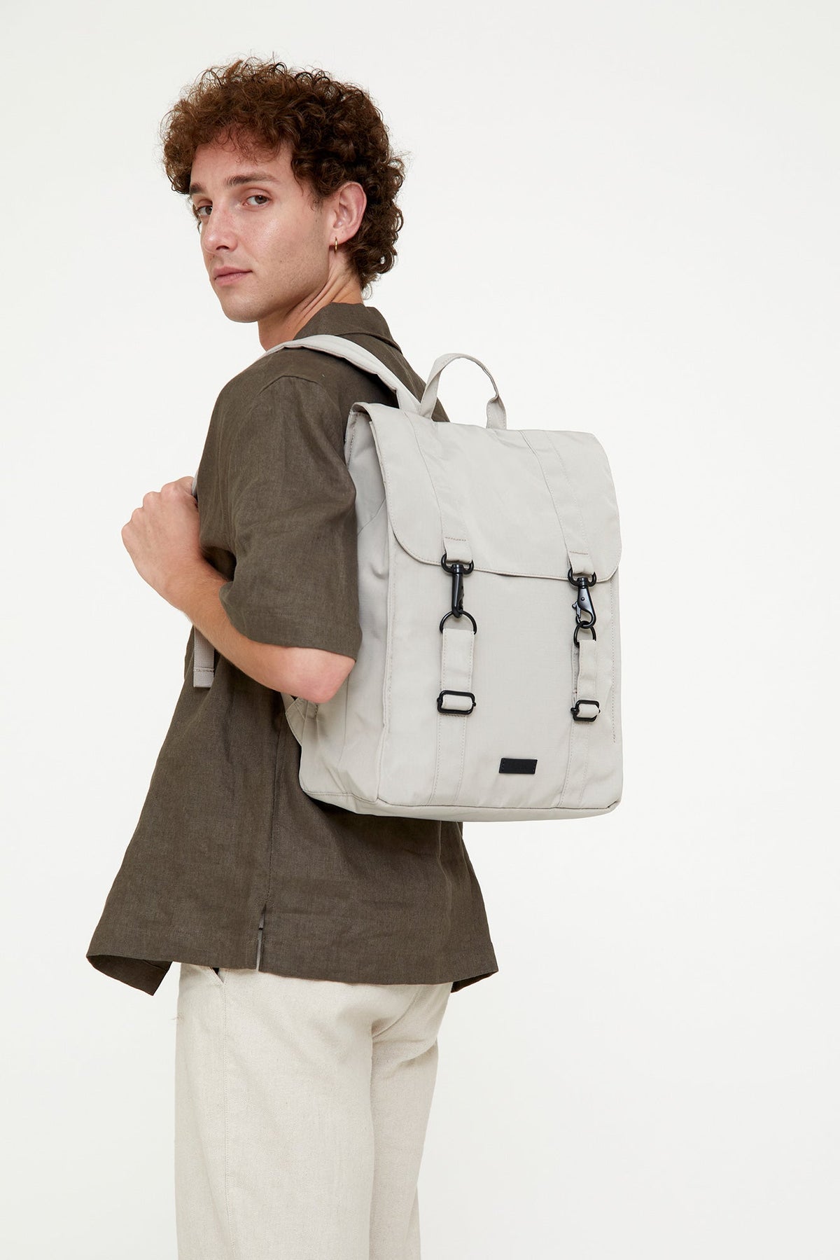 Handy XL Backpack Fossil in light beige with laptop compartment worn by model Lefrik USA on Tampa Home & Garden Store