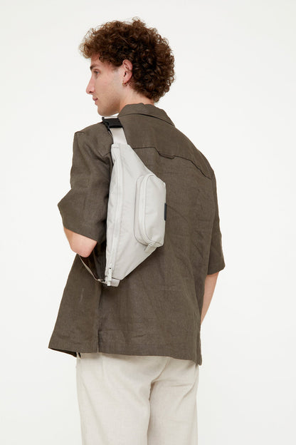 Urban Crossbody Bag Lefrik USA, light gray with front & main pockets, worn crossbody on Tampa Home & Garden Store