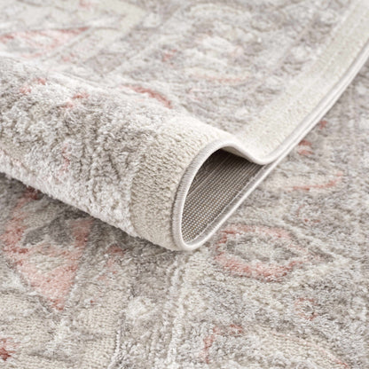 Damla Area Rug by Boutique Rugs, plush light gray pile with pale pink accents and a beige border on Tampa Home & Garden Store