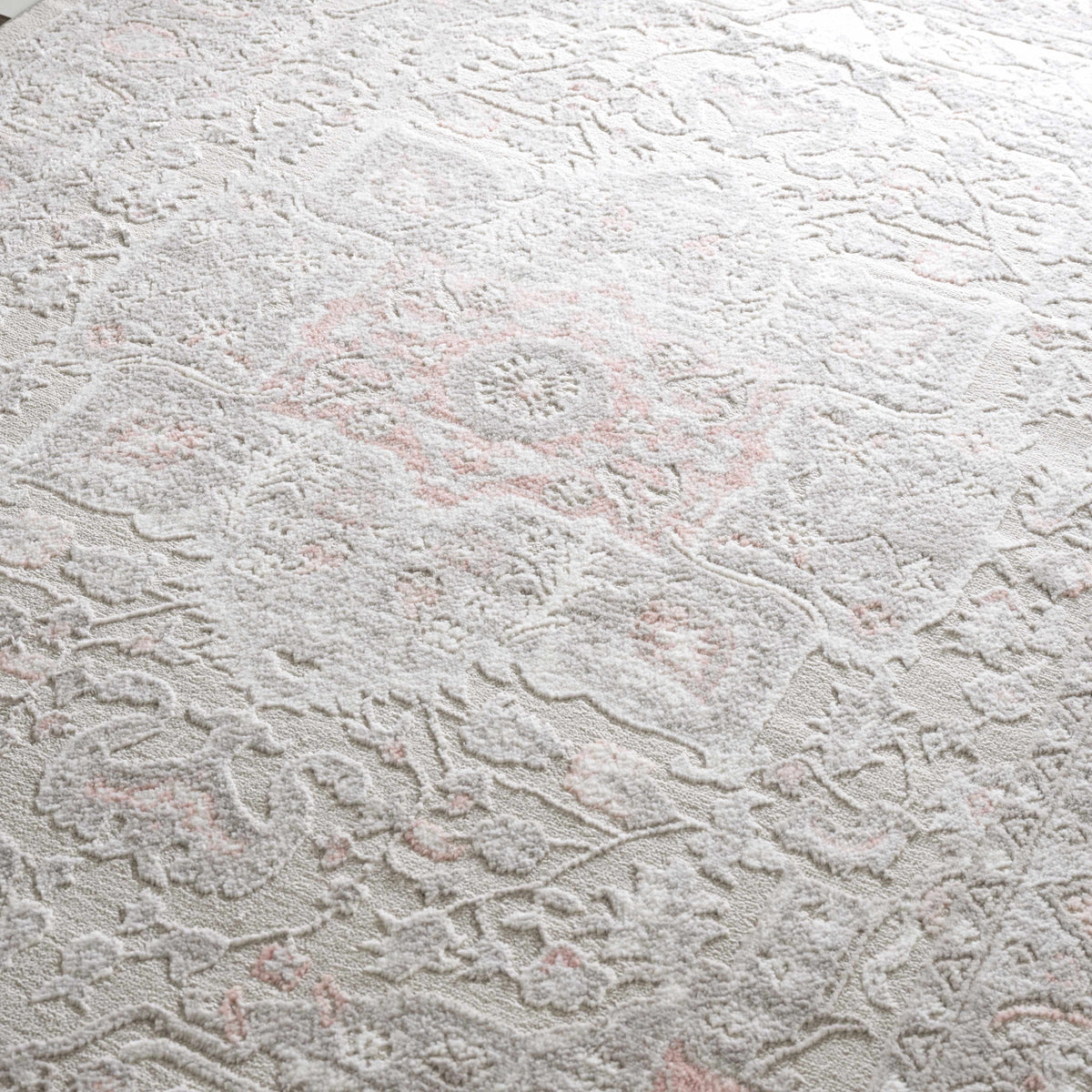 Damla Area Rug by Boutique Rugs, ivory with pink accents, plush distressed floral motif on Tampa Home & Garden Store