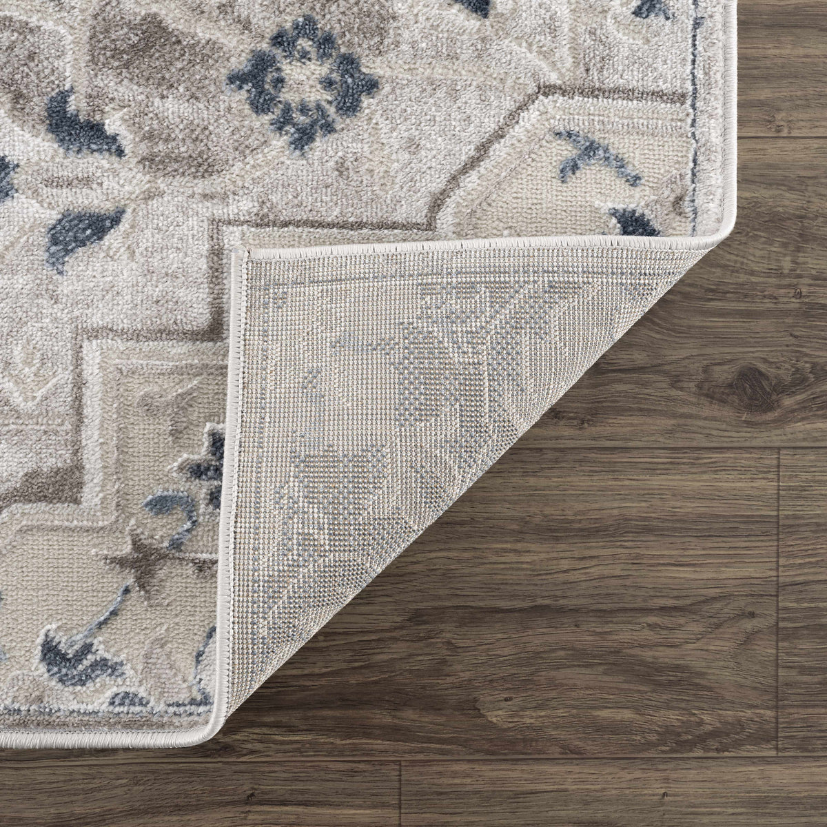 Calum Blue & Gray Area Rug by Boutique Rugs, soft high-pile beige with blue motifs, on Tampa Home & Garden Store