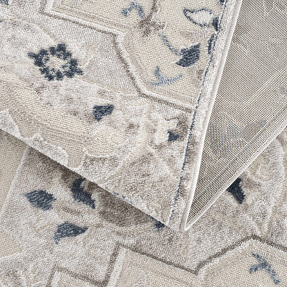 Calum blue & gray area rug beige backdrop with blue floral accents, bound edges on Tampa Home & Garden Store