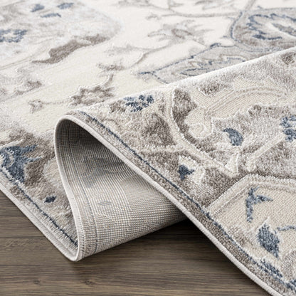 Calum blue gray area rug by Boutique Rugs, beige pattern with rolled edges on Tampa Home & Garden Store