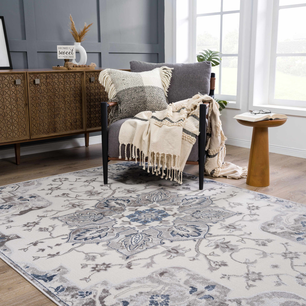Calum blue and gray area rug by Boutique Rugs, ornate floral pattern on light background on Tampa Home & Garden Store